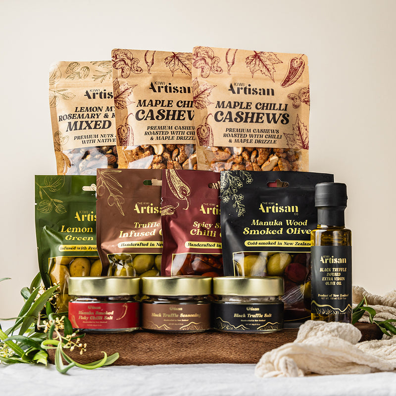 Assorted Artisan food products including nuts, infused olives, truffle olive oil and seasonings