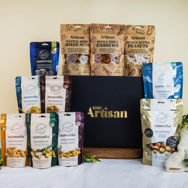 Kiwi Artisam Gourmet Nut Gift Box - featuring Assorted nut packages from Kiwi Artisan on a white surface with a neutral background