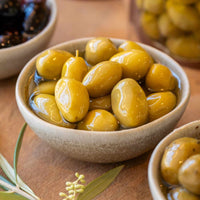 Four Flavours of Artisan Olives: Manuka Smoked, Sichuan Chilli, Truffle Oil, and Lemon Myrtle & Kawakawa