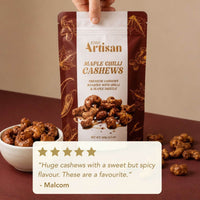 Kiwi Artisan Maple Chilli Cashews packaging with cashews and a bowl on a brown background and customer review