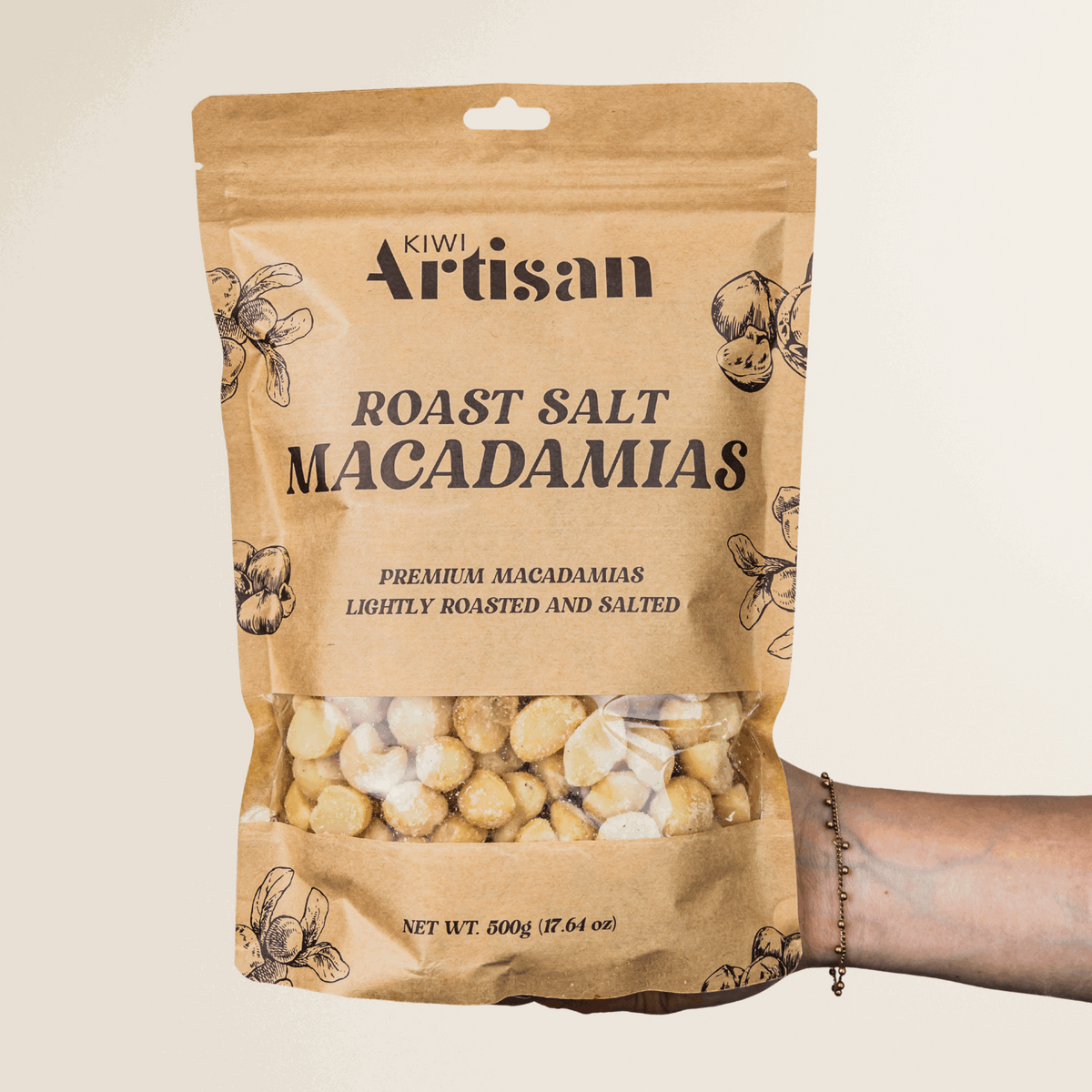 Bag of Kiwi Artisan Roast Salt Macadamias on a beige background